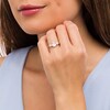 Thumbnail Image 2 of Oval White Lab-Created Sapphire and 1/6 CT. T.W. Diamond Frame Three Stone Engagement Ring in 10K Rose Gold