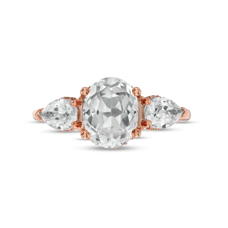 Main Image 4 of Oval White Lab-Created Sapphire and 1/6 CT. T.W. Diamond Frame Three Stone Engagement Ring in 10K Rose Gold