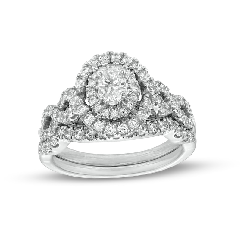 Main Image 1 of 1 CT. T.W. Oval Diamond Double Frame Twist Shank Bridal Set in 14K White Gold