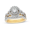 Thumbnail Image 1 of 1 CT. T.W. Oval Diamond Double Frame Twist Shank Bridal Set in 14K Gold