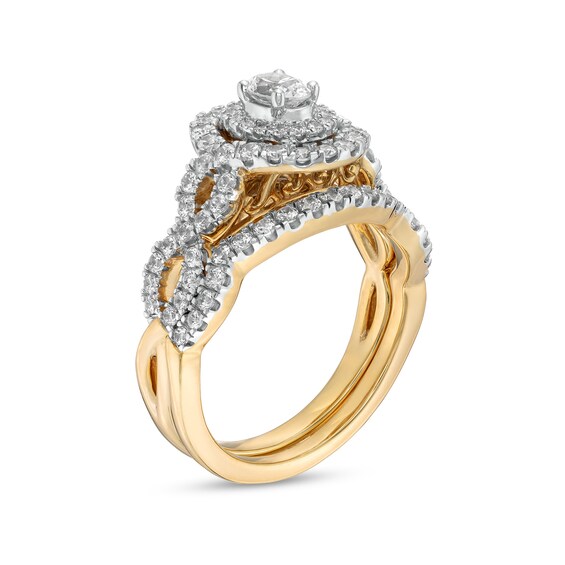 1 CT. T.w. Oval Diamond Double Frame Twist Shank Bridal Set in 14K Gold