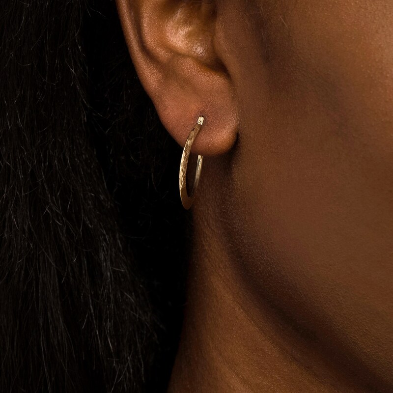 Main Image 2 of 26.06mm Diamond-Cut Knife Edge Tube Oval Hoop Earrings in 10K Gold