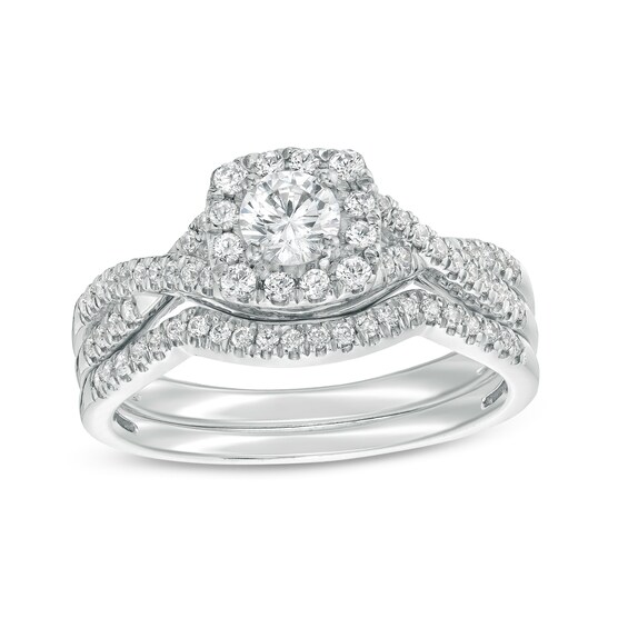 3/4 CT. T.w. Certified Diamond Cushion-Shaped Frame Twist Shank Bridal Set in 14K White Gold (I/I2)