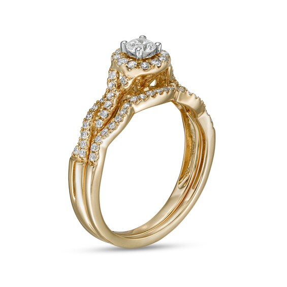 1/2 CT. T.w. Diamond Frame Twist Shank Bridal Set in 10K Gold (I/I2)