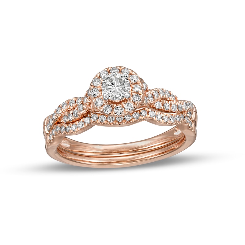 Main Image 1 of 1/2 CT. T.W. Diamond Frame Twist Shank Bridal Set in 10K Rose Gold (I/I2)