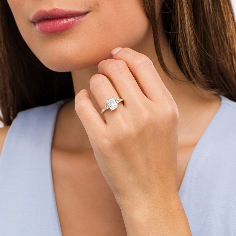 Main Image 2 of Emerald-Cut White Lab-Created Sapphire and 1/10 CT. T.W. Diamond Three Stone Engagement Ring in 14K Gold Over Silver