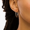 Thumbnail Image 1 of 25.0mm Textured Tube Hoop Earrings in 14K Gold