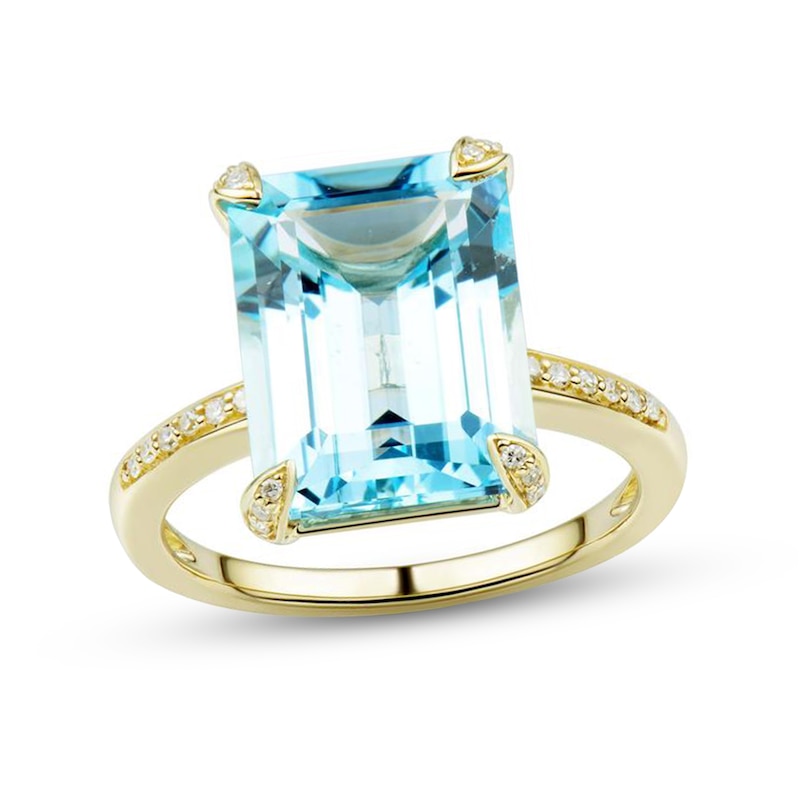 Emerald-Cut Faceted Sky Blue Topaz and 1/10 CT. T.W. Diamond Four-Corner Overlay Accent Ring in 10K Gold - Size 7