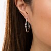 Thumbnail Image 3 of Marilyn Monroe™ Collection 1/2 CT. T.W. Diamond Hoop Earrings in 10K White Gold