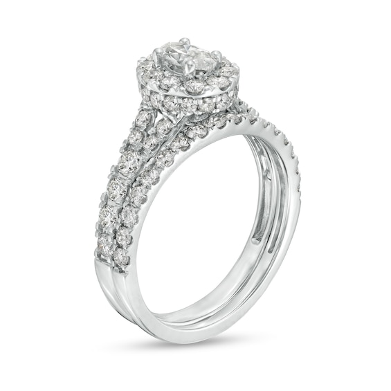 1-1/2 CT. T.w. Oval Diamond Frame Split Shank Bridal Set in 10K White Gold