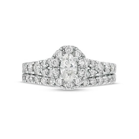 1-1/2 CT. T.w. Oval Diamond Frame Split Shank Bridal Set in 10K White Gold