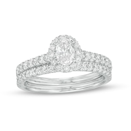 1 CT. T.W. Oval Diamond Frame Bridal Set in 10K White Gold