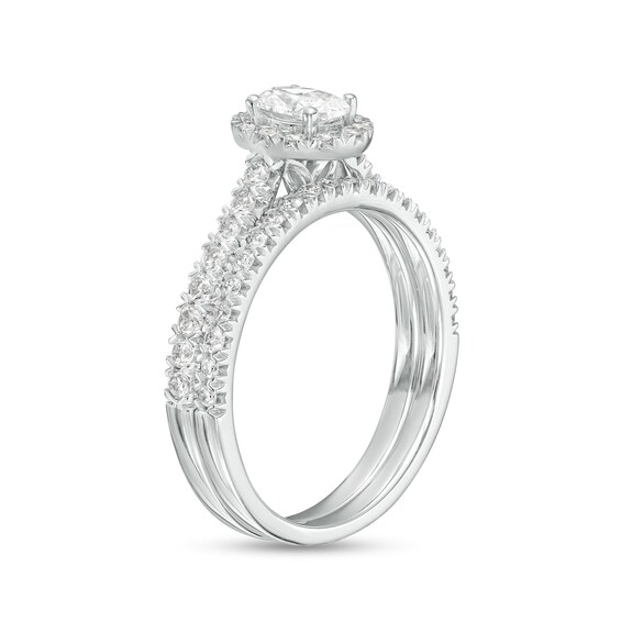 1 CT. T.w. Oval Diamond Frame Bridal Set in 10K White Gold