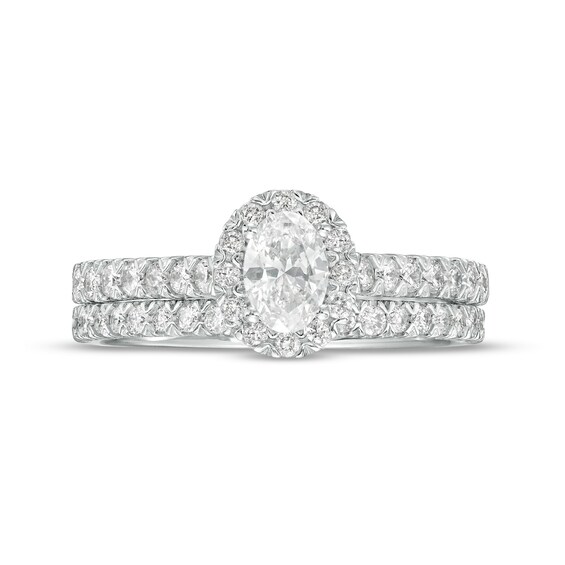 1 CT. T.w. Oval Diamond Frame Bridal Set in 10K White Gold