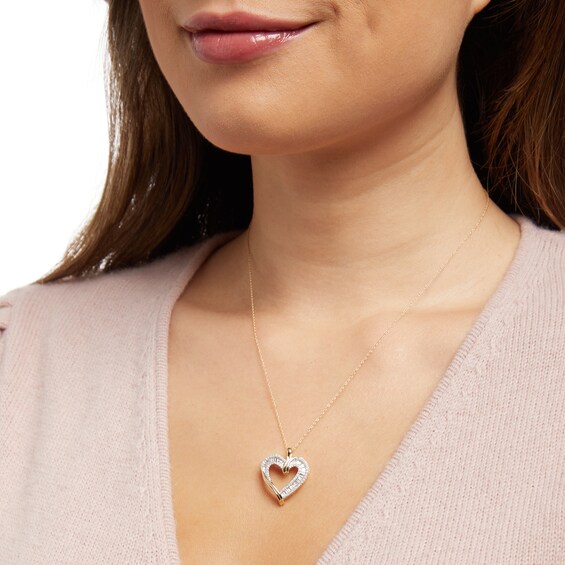 1/2 CT. T.w. Diamond Triple Row Heart Pendant in 10K Gold