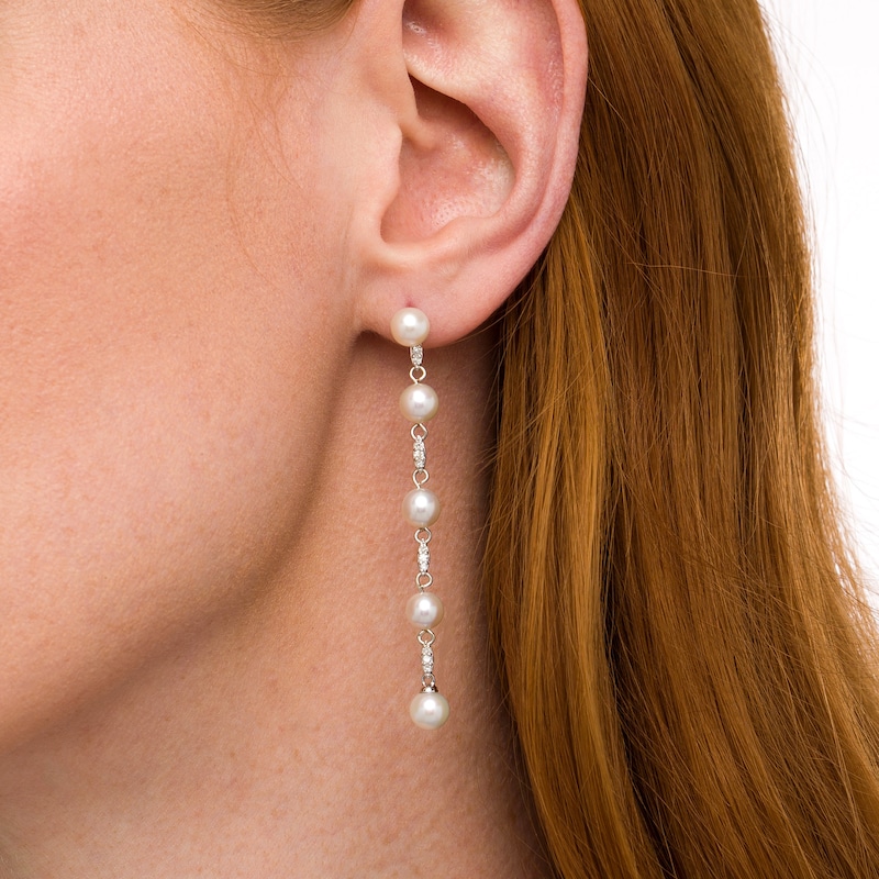 Main Image 3 of Marilyn Monroe™ Collection 6.0mm Freshwater Cultured Pearl and 1/6 CT. T.W. Diamond Drop Earrings in 10K White Gold
