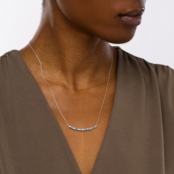 Alternating Baguette and Round Swiss Blue Topaz Curved Bar Necklace in Sterling Silver
