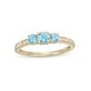 Thumbnail Image 1 of Swiss Blue Topaz and Diamond Accent Three Stone Ring in 10K Gold