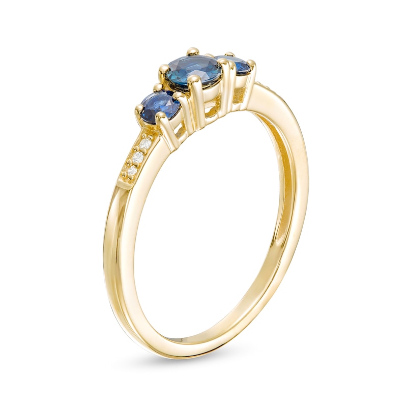Main Image 3 of Blue Sapphire and Diamond Accent Three Stone Ring in 10K Gold