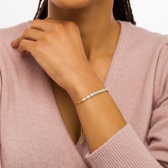 1/2 CT. T.w. Multi-Diamond Nine Stone "X" Bolo Bracelet in 10K Gold - 9.5"