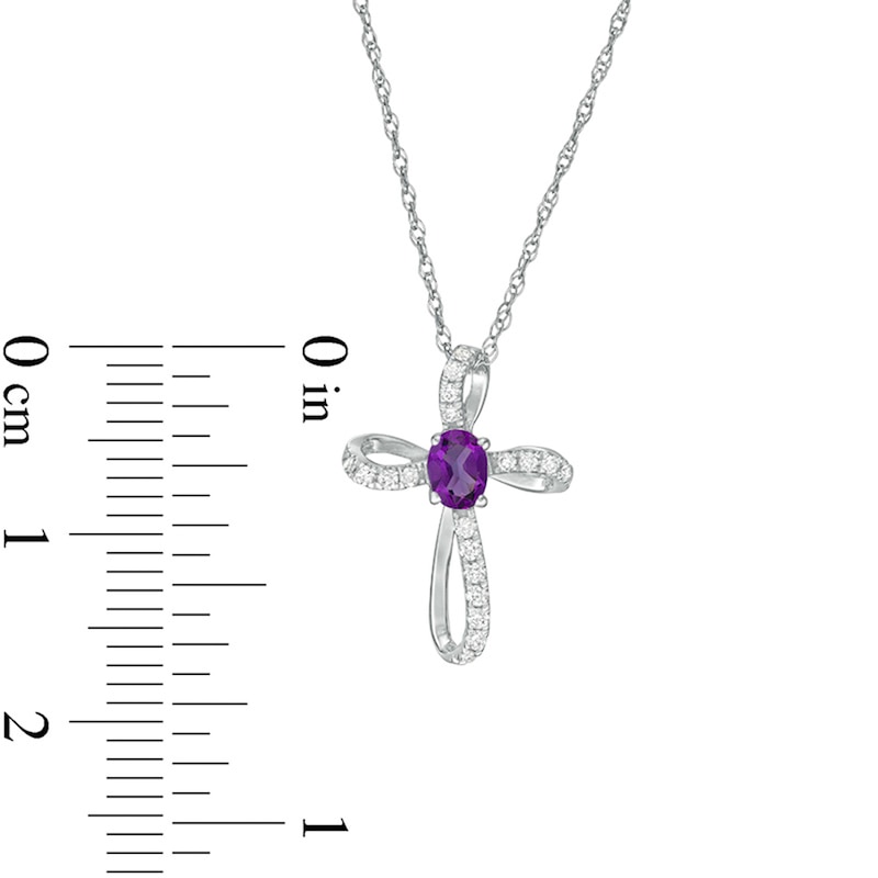 Main Image 2 of Oval Amethyst and 1/10 CT. T.W. Diamond Pinwheel Cross Pendant in 10K White Gold