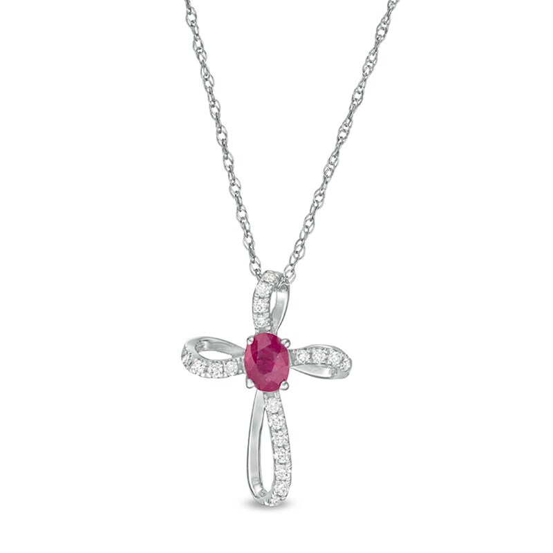 Main Image 1 of Oval Ruby and 1/10 CT. T.W. Diamond Pinwheel Cross Pendant in 10K White Gold