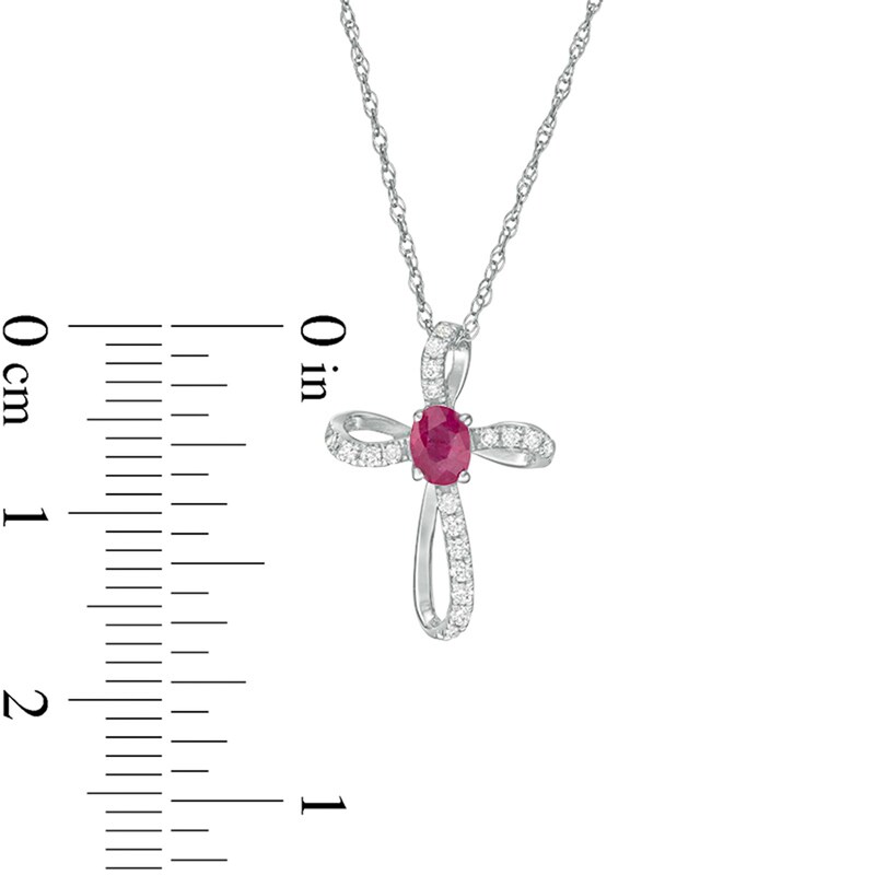 Main Image 2 of Oval Ruby and 1/10 CT. T.W. Diamond Pinwheel Cross Pendant in 10K White Gold