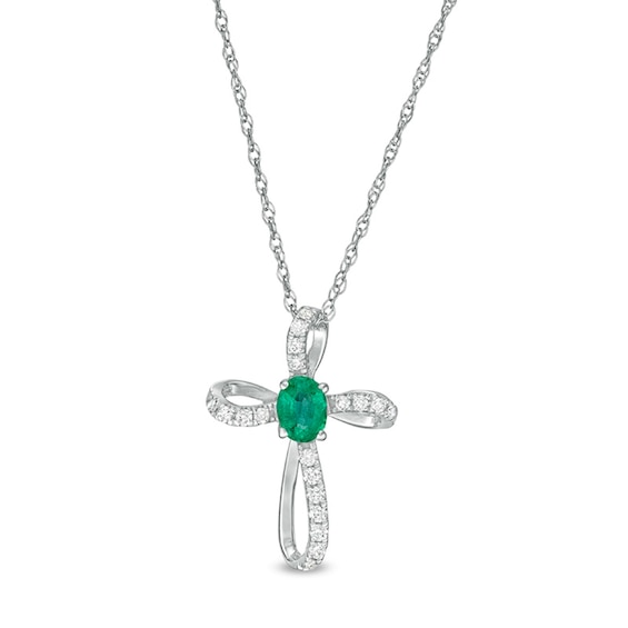 Oval Emerald and 1/10 CT. T.w. Diamond Pinwheel Cross Pendant in 10K White Gold