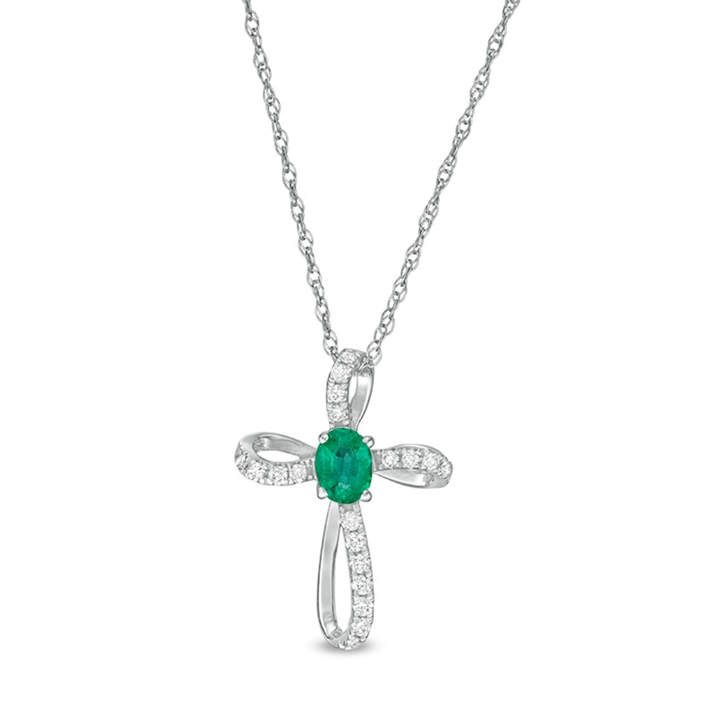 Main Image 1 of Oval Emerald and 1/10 CT. T.W. Diamond Pinwheel Cross Pendant in 10K White Gold