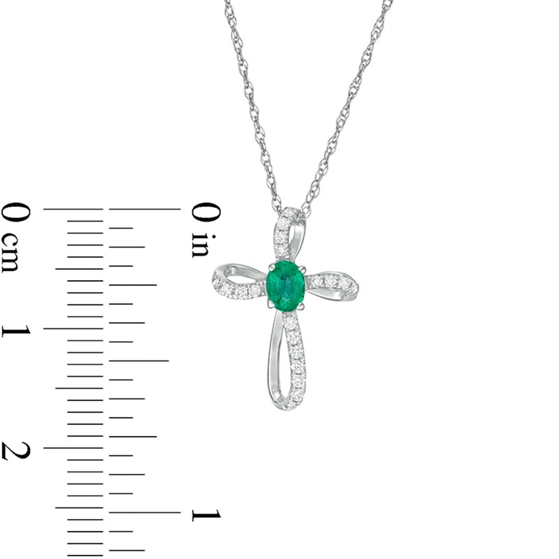 Main Image 2 of Oval Emerald and 1/10 CT. T.W. Diamond Pinwheel Cross Pendant in 10K White Gold
