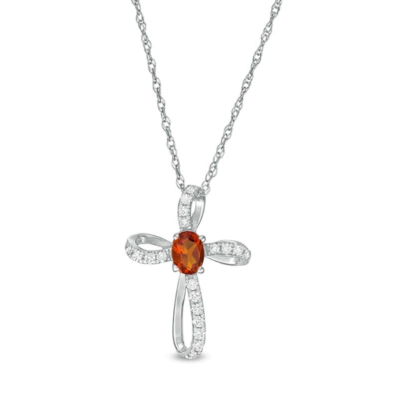 Main Image 1 of Oval Citrine and 1/10 CT. T.W. Diamond Pinwheel Cross Pendant in 10K White Gold