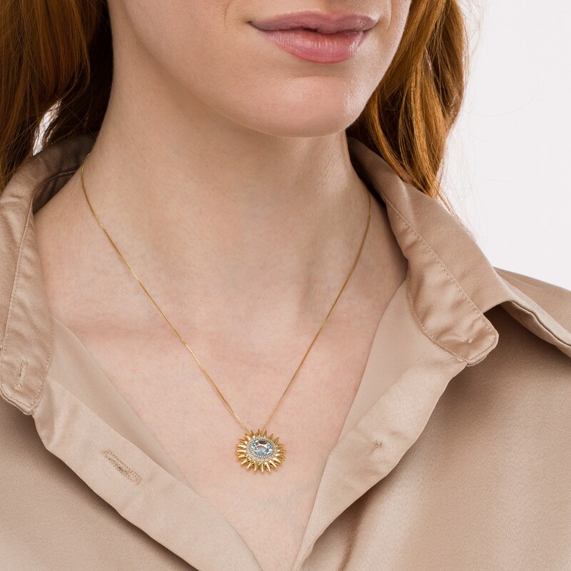 Main Image 2 of 9.0mm Sky Blue Topaz and 1/10 CT. T.W. Diamond Frame Sunburst Pendant in Sterling Silver with 14K Gold Plate