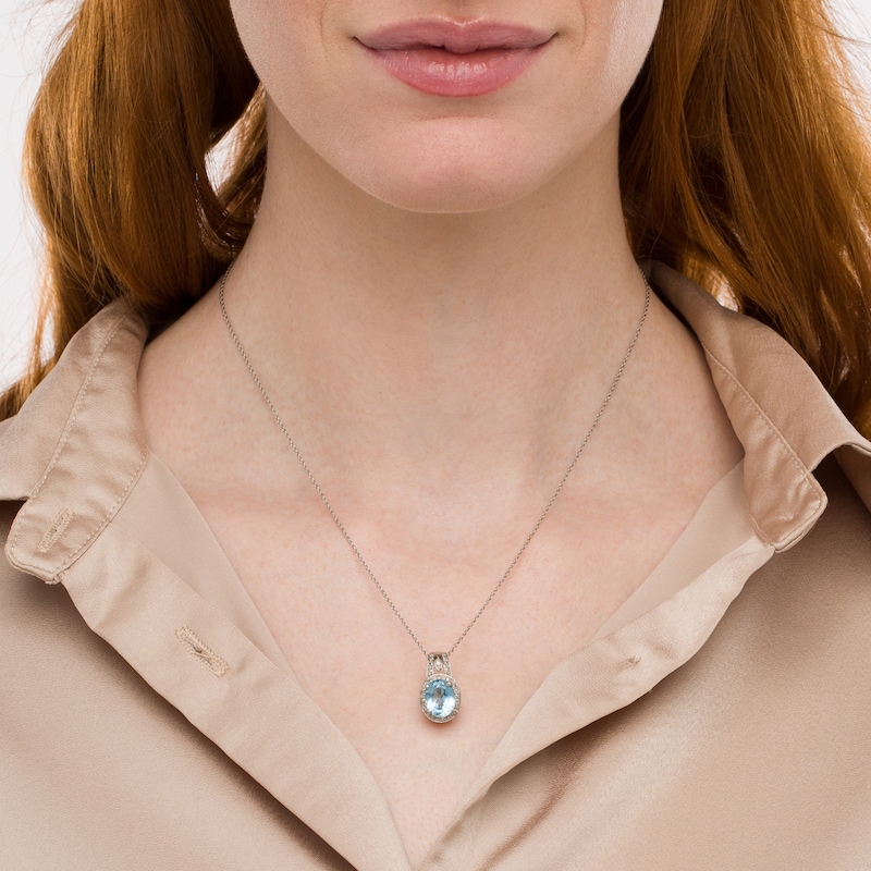 Main Image 2 of Oval Sky Blue Topaz and Diamond Accent Bead Frame Pendant in Sterling Silver