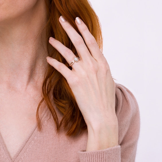 1/15 CT. T.w. Marquise-Shaped Multi-Diamond Frame Twisted Split Shank Promise Ring in 10K Rose Gold