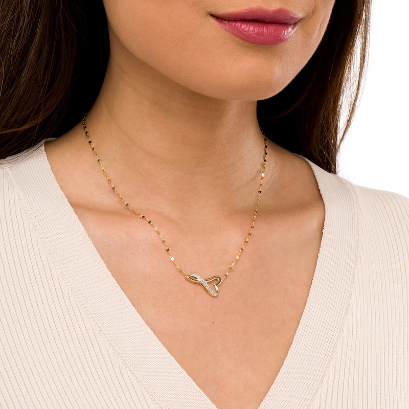 Main Image 2 of 1/6 CT. T.W. Diamond Sideways Twisted Heart Necklace in 10K Gold