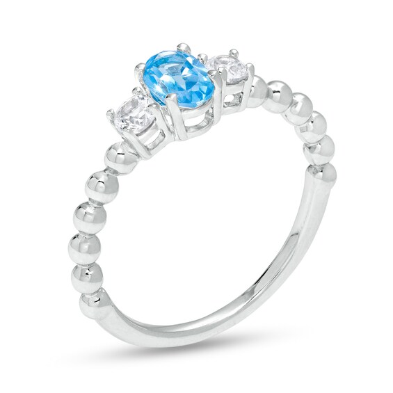 Oval Blue Topaz and White Lab-Created Sapphire Three Stone Bead Ring in Sterling Silver