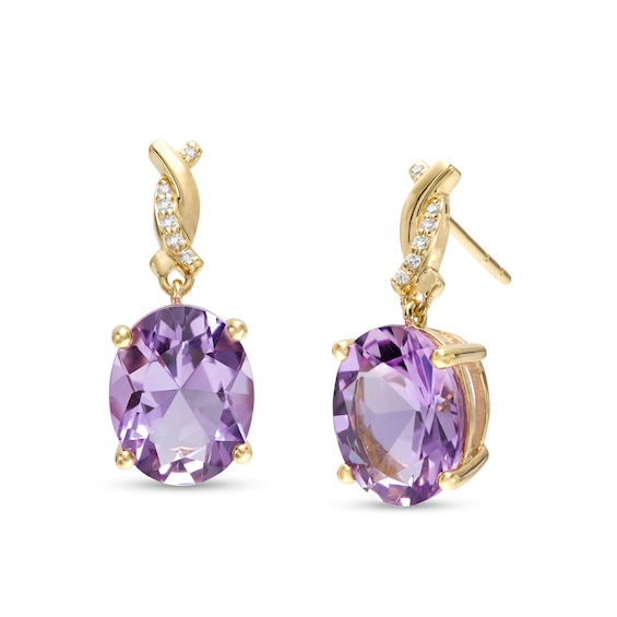 Oval Amethyst and 1/20 CT. T.w. Diamond Twist Drop Earrings in 10K Gold