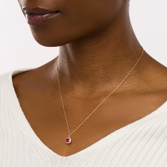 5.0mm Cushion-Shaped Lab-Created Ruby and 1/8 CT. T.w. Diamond Starburst Frame Drop Pendant in 10K Gold