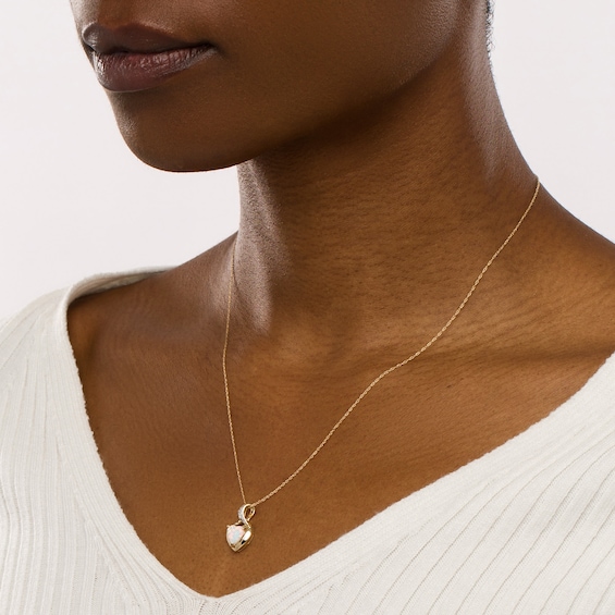 7.0mm Heart-Shaped Lab-Created Opal Cabochon and Diamond Accent Twist Bail Pendant in 10K Gold