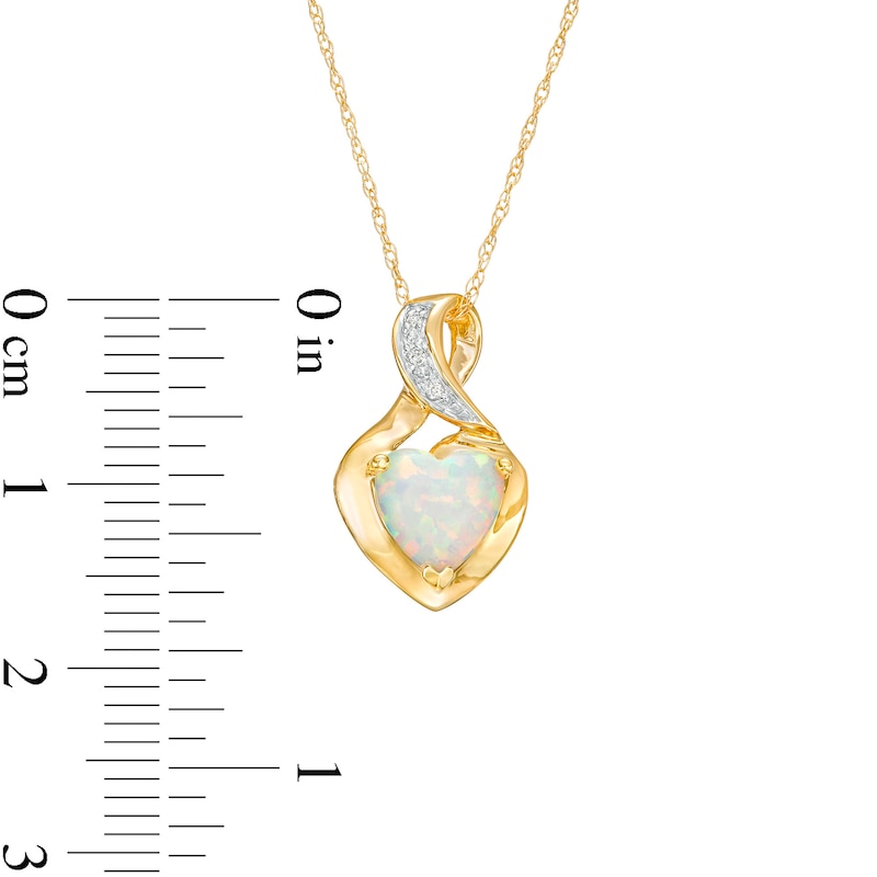 7.0mm Heart-Shaped Lab-Created Opal Cabochon and Diamond Accent Twist Bail Pendant in 10K Gold