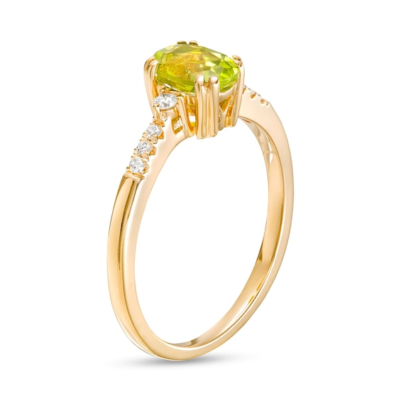 Oval Peridot and 1/10 CT. T.w. Diamond Ring in 10K Gold