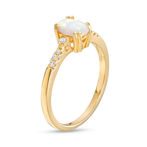 Oval Lab-Created Opal Cabochon and 1/10 CT. T.w. Diamond Ring in 10K Gold