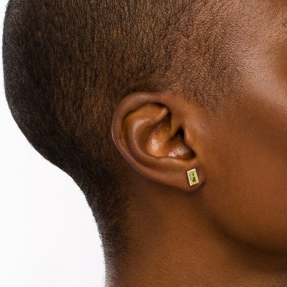 Sideways Baguette Peridot and 1/8 CT. T.w. Diamond Frame Stud Earrings in 10K Gold