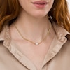 Thumbnail Image 1 of 1/2 CT. T.W. Oval-Shaped Multi-Diamond Sideways Necklace in 10K Gold - 16"