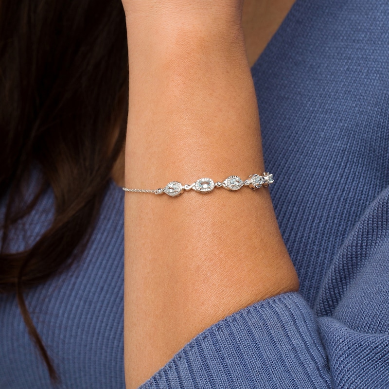 Main Image 2 of Oval Aquamarine and Diamond Accent Twist Five Stone Bracelet in 10K White Gold – 8.0"