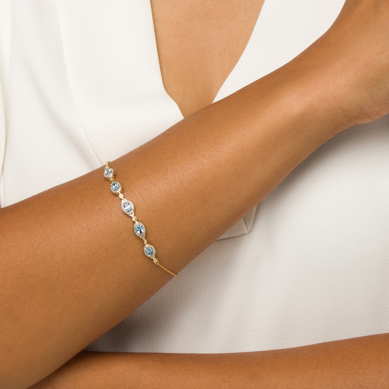 Main Image 2 of Oval Swiss Blue Topaz and Diamond Accent Twist Five Stone Bracelet in 10K Gold – 8.0"