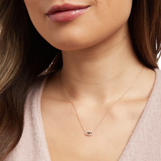 1/10 CT. T.w. Black and White Diamond Evil Eye Necklace in 10K Gold – 17"