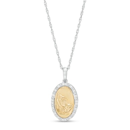 1/10 CT. T.W. Diamond Frame Praying Hands Oval Medallion Pendant in Sterling Silver and 10K Gold