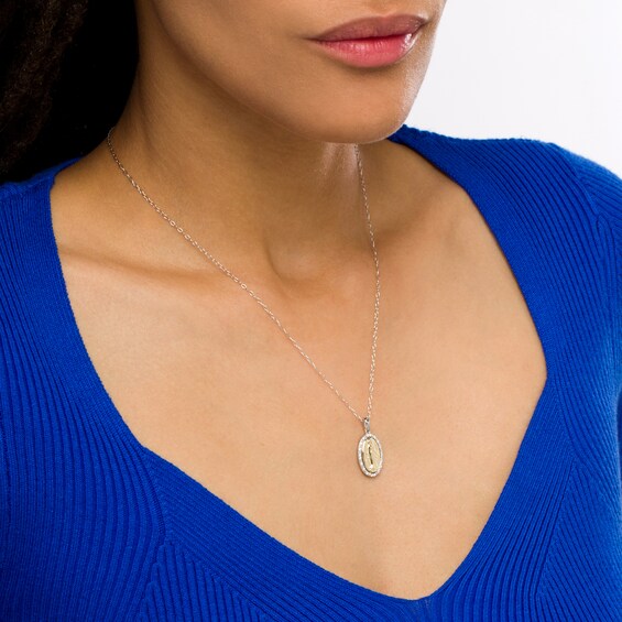 1/10 CT. T.w. Diamond Guadalupe Oval Medallion Pendant in Sterling Silver and 10K Gold