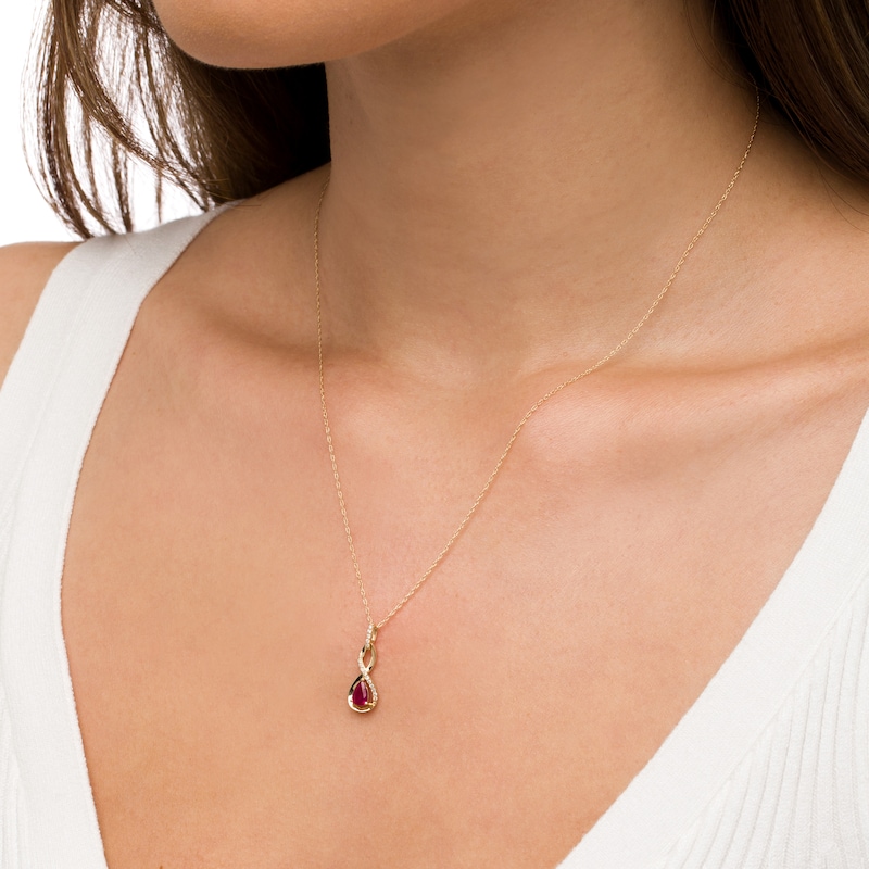 Pear-Shaped Ruby and 1/20 CT. T.W. Diamond Twist Pendant in 10K Gold